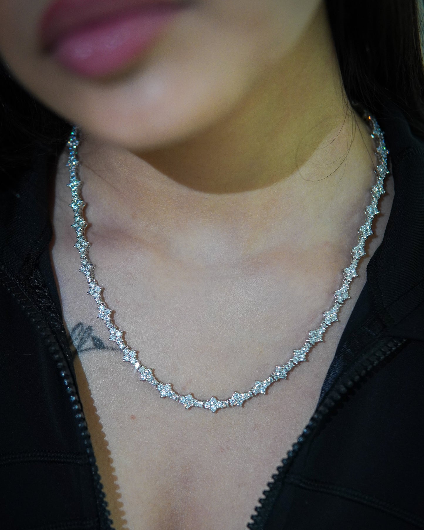 Elegant Diamond tennis chain necklace shimmering on a model's neck, perfect for special occasions